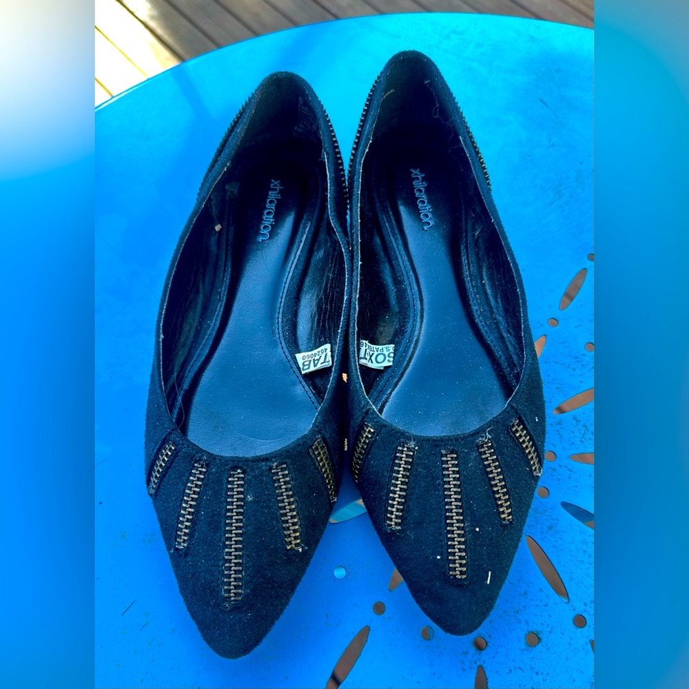 Black flats with zipper accents